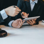 At the meeting, a team of lawyers discussed the lawsuit. Concept of law and justice. At the meeting, a team of lawyers discussed the lawsuit. Concept of law and justice.